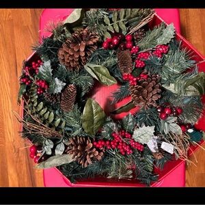 Christmas Holiday Wreath with Pinecones, red berries, white lights.